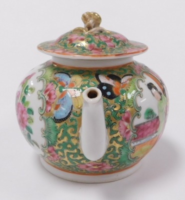 A 19thC Qing dynasty Chinese porcelain miniature teapot, in famille rose Canton style, with figures, birds and flora, the cover with gilt knop, 9cm high. - 2