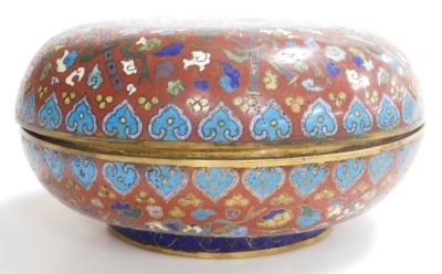 A 19thC Chinese circular compressed cloisonne enamel box, decorated with emblems of flowers and precious objects, on a red ground, the cover with central panel of butterflies and flower heads in polychrome enamels, on a blue ground, 11cm high, 24cm diamet - 3