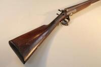 An Adams 12 bore shotgun