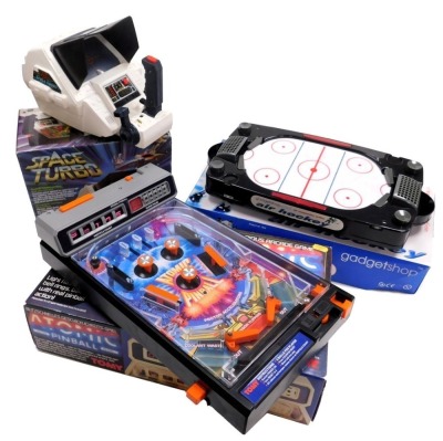 A Tomy Atomic Pinball Arcade action game, Space Tubro ref number 7062, and Gadget Shop air hockey. (3)