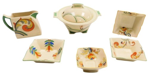 A group of Royal Doulton Art Deco pottery, comprising a Dubarry pattern small vegetable tureen and cover, Syren pattern cream jug, Cresta pattern sugar bowl, and three square dishes, in the Mecca, Syren and Cresta patterns. (6)