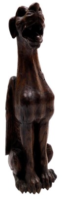 A 19thC carved oak figure of a winged lioness, modelled in standing pose, 37cm high.