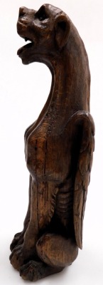 A 19thC carved oak figure of a winged lioness, modelled in standing pose, 37cm high. - 2