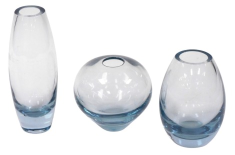 Three Holmegaard blue tinted glass vases, number 5927, 14cm high, 5391, 22cm high, and 15388, 16cm high.