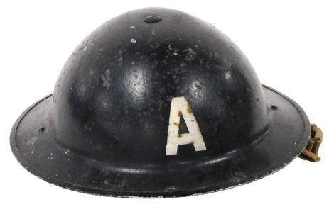 A World War II ambulance crew helmet, stamped ISC 1939, 28cm wide.