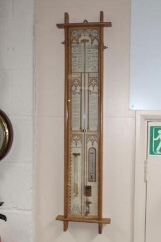 An Admiral Fitzroy barometer in light oak case