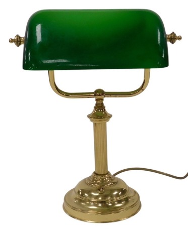 A brass desk lamp, with an angled green glass shade, 36.5cm high.