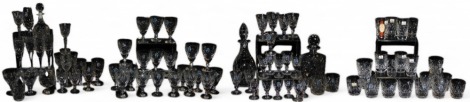 A suite of Royal Doulton Georgian pattern crystal table wares, including decanters and stoppers, red and white wine glasses, whisky tumblers, sherry and liqueur glasses, most boxed.