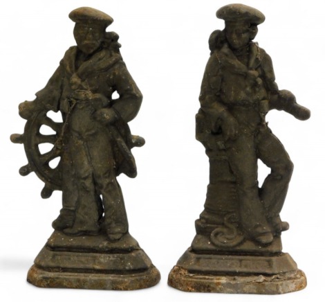 A pair of Victorian cast iron door stops, modelled as Royal Naval sailors, 28cm high.