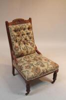 A late Victorian aesthetic movement period upholstered chair.