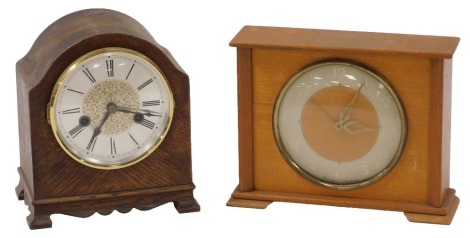 A Hac German oak cased mantel clock, the silvered circular dial bearing Roman numerals, eight day movement, the case 21cm high, together with a Westclox beech cased electric mantel clock, circular dial bearing Arabic numerals, the case 18.5cm high.