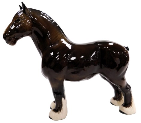 A Beswick pottery figure modelled as a shire horse, 17cm high.