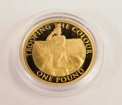 A Westminster proof Trooping the Colour gold one pound coin dated 2022, with issue number 77/400, in a presentation box. - 2