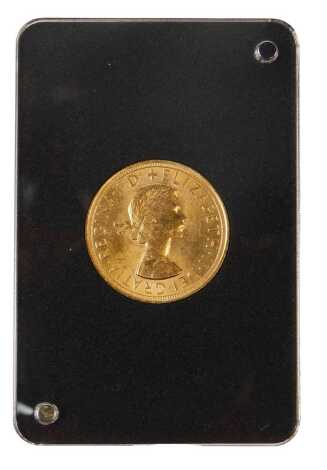 An Elizabeth II full gold proof sovereign dated 1957, with associated certificates, in a presentation box.