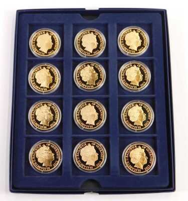 A Royal Air Force Squadrons of the Air Force coin collection, comprising twelve coins, each copper with 24ct gold plating, with certificate, in a presentation box.