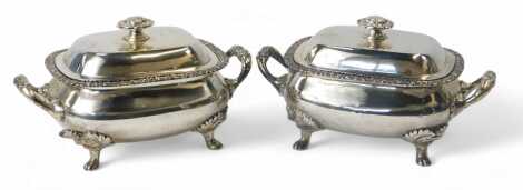 A pair of George III twin-handled lidded serving dishes, the lid with a flower head knop, the border of the serving dish decorated with leaves and flower heads, on four leaf and shell capped legs on paw feet, Henry Nutting or Hannah Northcote, London 1778