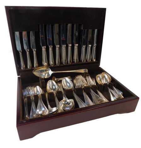 A George III/IV silver bead pattern part canteen of cutlery, comprising twelve dinner forks, Jonathan Hayne, London 1831/1832, twelve tablespoons, William Chawner II, London 1833 (11) and Jonathan Perkins (1), London 1801, eleven dessert spoons, Phillip P