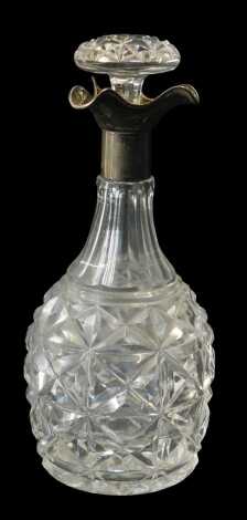 A George V cut glass and silver mounted decanter, of faceted bottle form, with a triform silver collar, Walter & Charles Sissons, Sheffield 1925, 27cm high.