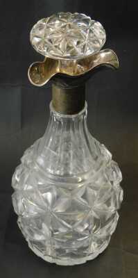 A George V cut glass and silver mounted decanter, of faceted bottle form, with a triform silver collar, Walter & Charles Sissons, Sheffield 1925, 27cm high. - 2