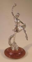 A rare chrome plated car mascot of a ballerina on a garland base