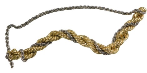 A bicolour rope twist bracelet, on a snap clasp, stamped 750, 55.5g. (AF)