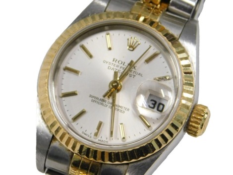 A Rolex lady's bicolour stainless steel cased wristwatch, Oyster Perpetual, Datejust, silver dial with batons, centre seconds, date aperture, superlative chronometer, on a bracelet strap.