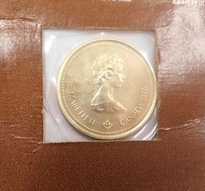 A Canadian Olympic one hundred dollar Montreal 1976 yellow metal coin, 7.77g. - 2