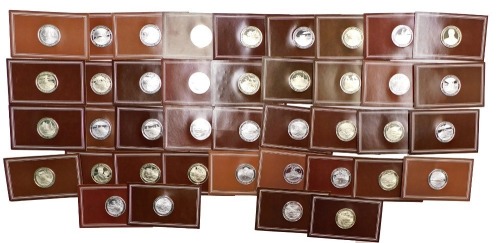 Forty John Pinches silver medallions, The Mountbatten Medallic History of Great Britain and The Sea series, mounted in brown card.