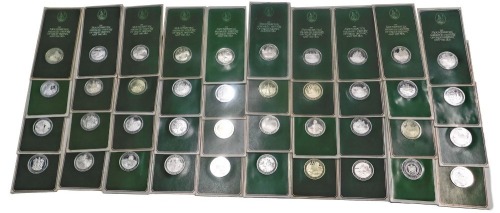 Sixty three John Pinches silver medallions, the Mountbatten Medallic History of Great Britain and The Sea series, mainly mounted in green card.