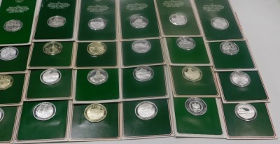 Sixty three John Pinches silver medallions, the Mountbatten Medallic History of Great Britain and The Sea series, mainly mounted in green card. - 5