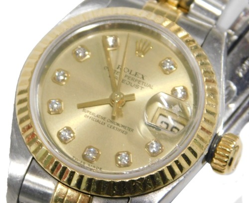 A Rolex lady's bicolour stainless steel cased wristwatch, Oyster Perpetual, Datejust, circular champagne dial, with diamond set markers, centre seconds, date aperture, on a bracelet strap, with certificate and guarantee, dated 2002, cased and outer boxed.