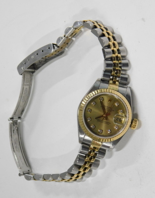 A Rolex lady's bicolour stainless steel cased wristwatch, Oyster Perpetual, Datejust, circular champagne dial, with diamond set markers, centre seconds, date aperture, on a bracelet strap, with certificate and guarantee, dated 2002, cased and outer boxed. - 2