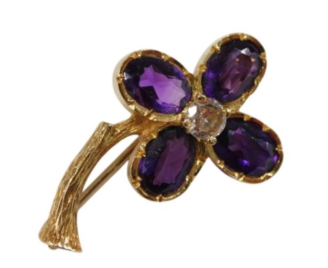 An 18ct gold amethyst and diamond brooch, in a flower and branch design, diamond approx ¼ct, 4.4g.