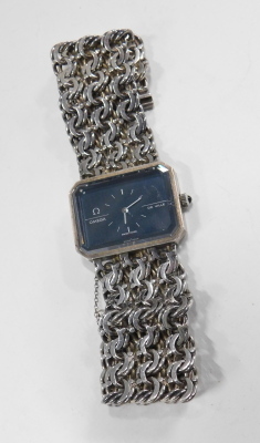 An Omega DeVille lady's silver cased wristwatch, canted black rectangular dial, on a three bar circular link bracelet strap. - 2