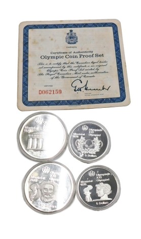 A 1973 Canadian Olympic proof four coin set, containing two silver ten dollars, and two five dollars, in presentation case, with certificate.