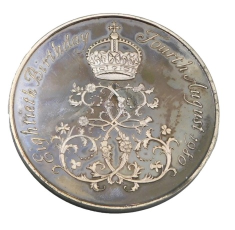 A sterling silver Spink medallion, made to commemorate the 80th Birthday of Her Majesty Queen Elizabeth The Queen Mother, 82g, with box and packaging.