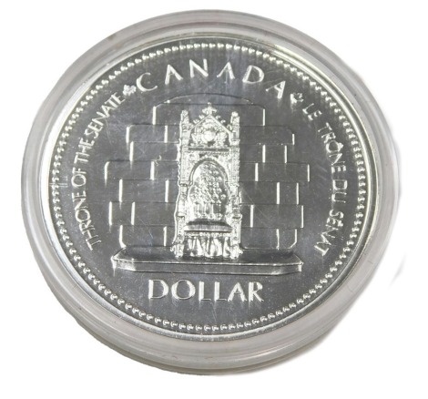 A silver Canadian Elizabeth II Jubilee 1977 dollar, in black case.