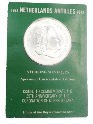 A 1973 Netherlands Antilles sterling silver specimen uncirculated edition coin, in original packaging.