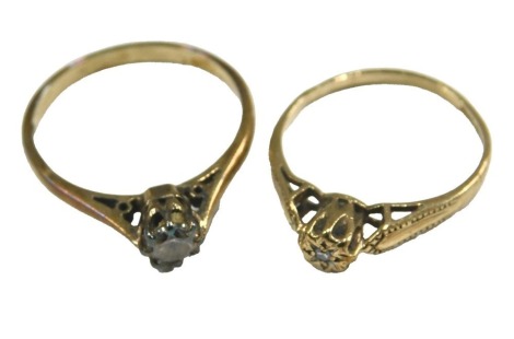 A 9ct gold and diamond solitaire ring, in a high claw setting, size I, together with a 9ct gold and cz ring, in a high claw setting, size L½, 2.4g.