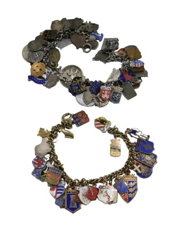 A silver charm bracelet, with assorted charms as fitted, including town, coats of arms and coins, on a bolt ring clasp, and a further charm bracelet, bearing towns, coats of arms, on a bolt ring clasp. (2)