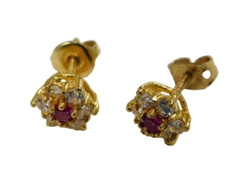 A pair of 22ct gold ruby and white stone flower hear earrings, on screw fittings, 2.6g.