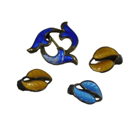 A pair of David Andersen silver and yellow guilloche enamel double leaf earrings, on clip fittings, together with a single blue guilloche earring, and a silver and guilloche enamel brooch of scrolling three leaf form.