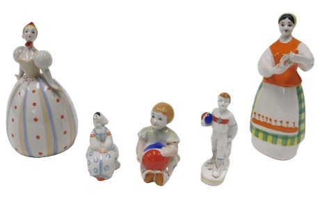 A collection of Ukraine porcelain figures, to include a lady holding a teapot, 18cm high.