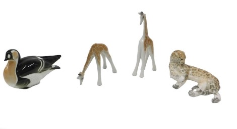 Two Lomonosov porcelain giraffes, a similar cheetah, and a goose. (4)