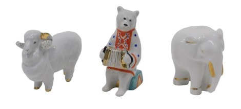 A Russian Lomonosov 1950s porcelain elephant, a similar ram, and a Dulevo circus bear.