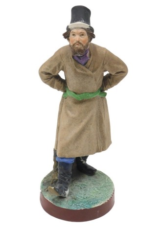 A 19thC Russian Gardner bisque porcelain figure of a gentleman, wearing a black hat and boots, with beige coat, on circular base, printed marks in red to underside and impressed marks, 22.5cm high. (AF)