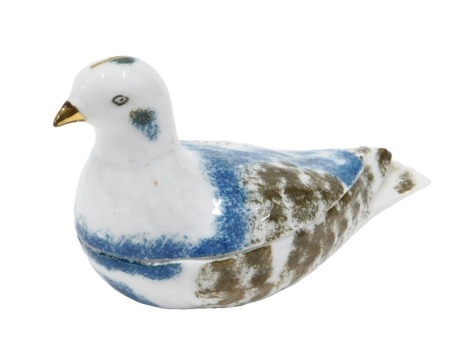 A 19thC Russian Kuznetsov porcelain box and cover, modelled in the form of a dove or pigeon, printed marks in turquoise to underside, 21cm wide.