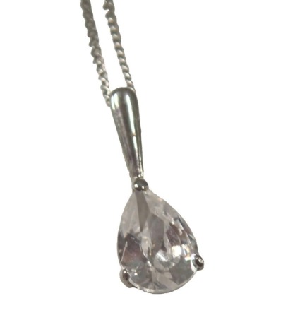 A single stone set pendant and chain, set with teardrop cut imitation diamond, in white setting stamped 9ct, 1cm high, on a fine link chain stamped 9ct, 42cm long, 1.3g all in.