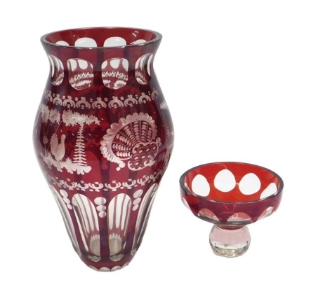 A Bohemian style ruby flash vase, decorated with deer, turkey, etc., 30cm high, and a similar bowl, 10cm high.