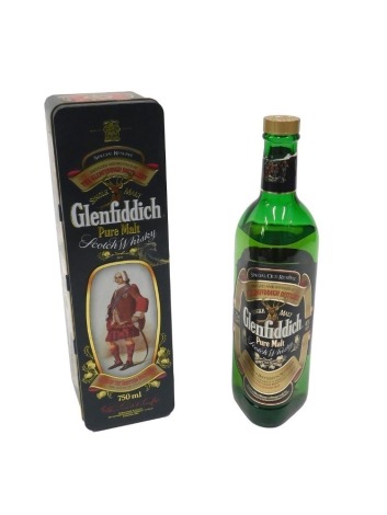 A bottle of Glenfiddich Pure Malt Scotch whisky Special Reserve, in presentation tin.